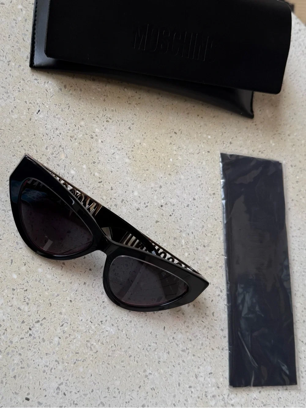Moschino Womens Black Cat-Eye Sunglasses with Subtle Pink Trim & Silver Hardware